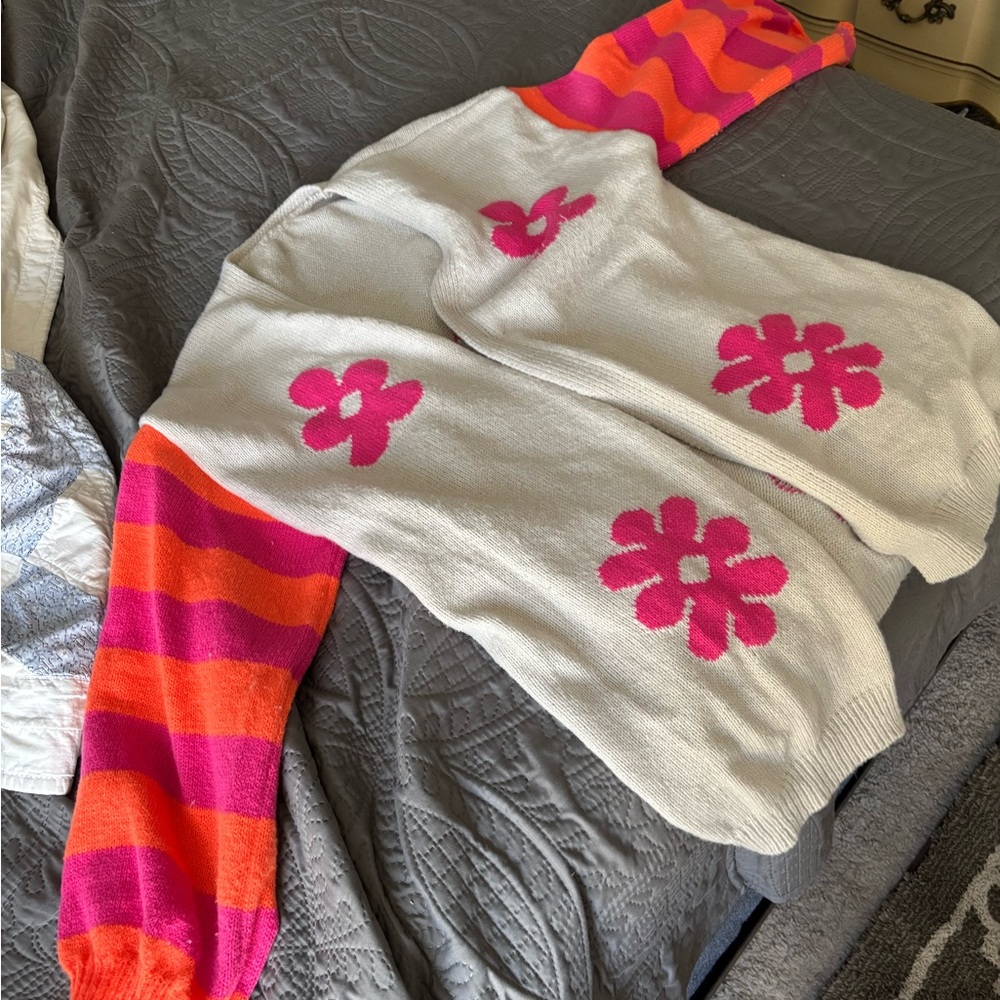 Cozy Cream Knit Sweater with Pink Flower Motifs and Striped Sleeves
